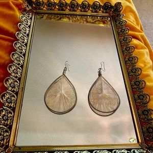 Teardrop weave earrings with a faint heart design inside.